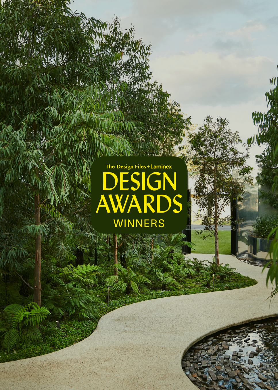 A garden with walking track feature and the words design awards winners.