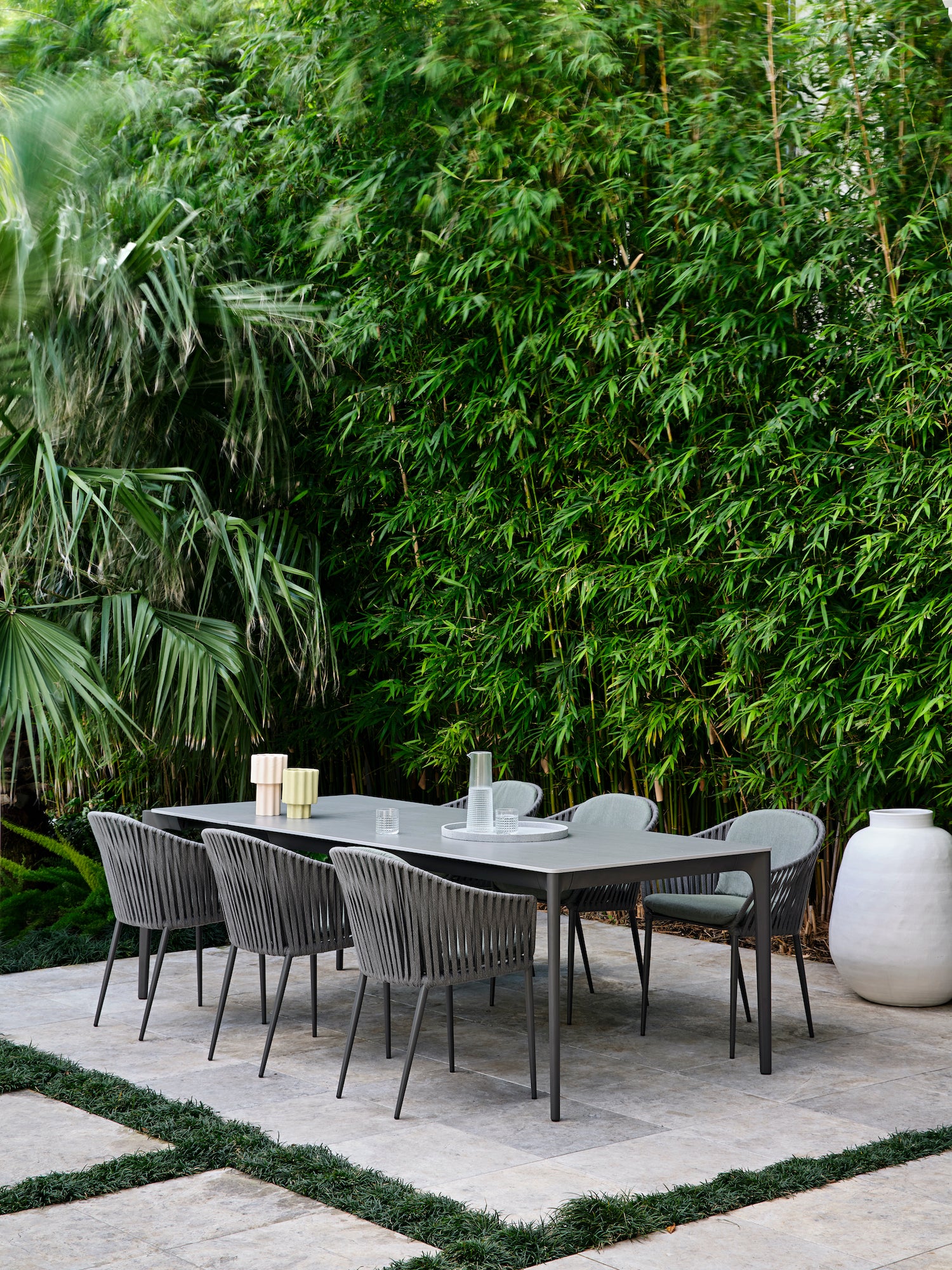 MALVERN PROJECT A table and chairs in front garden.